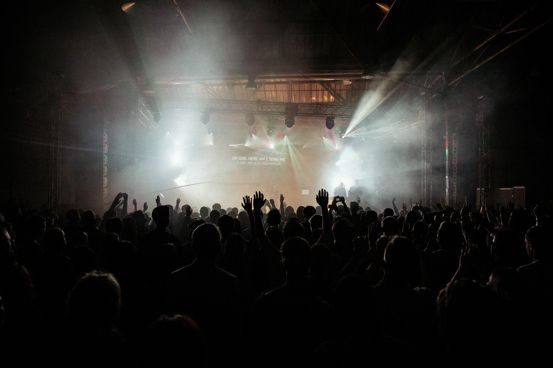 A lively concert scene with an excited crowd under vibrant stage lights